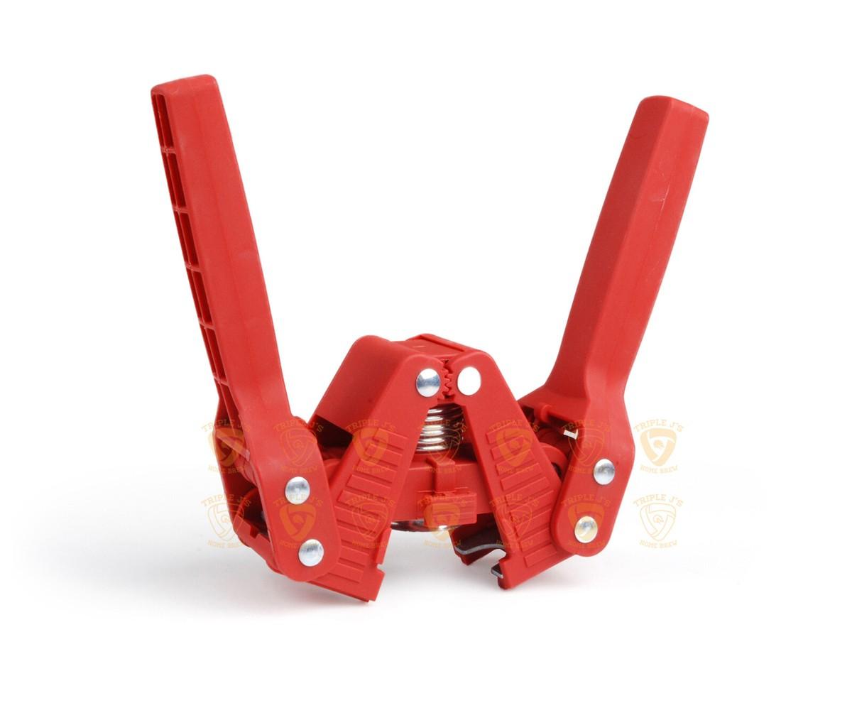 Red hand held capper